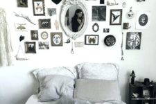 a monochromatic Halloween bedroom with a statement gallery wall that brigns that Halloween feel here