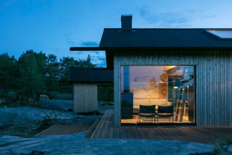 The cabins are contemporary and features a wooden exterior and black roofs plus some glazed parts to enjoy the views