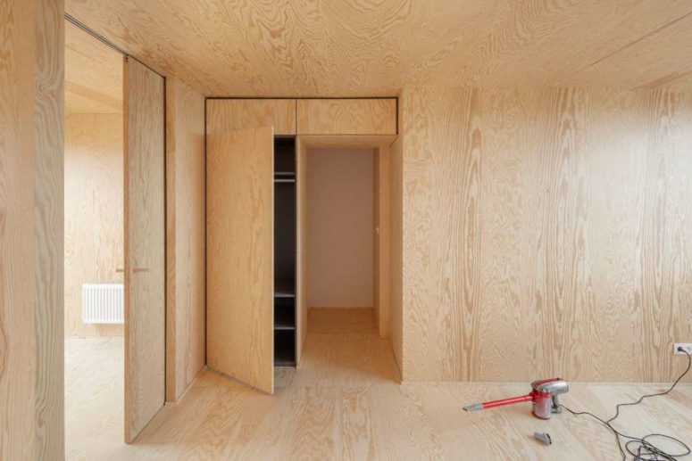The other spaces are done with light-colored plywood, there's plenty of storage space