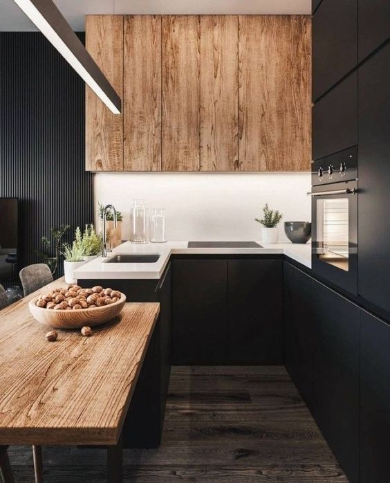 a black kitchen refresh with a white backsplash and wooden uppers plus a wooden countertop for a cozier feel