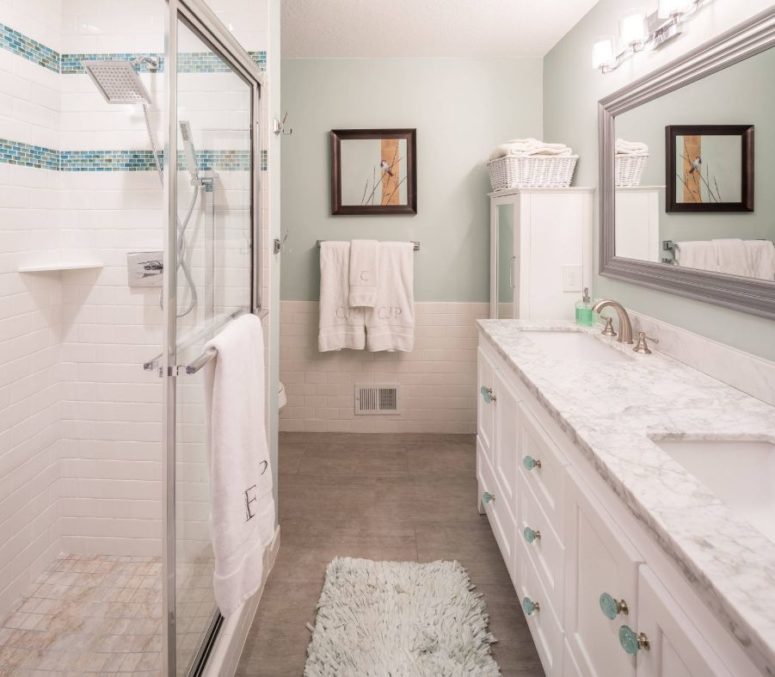 a very neutral and peaceful bathroom is refreshed with turquoise and aqua accents for a chic and calming feel