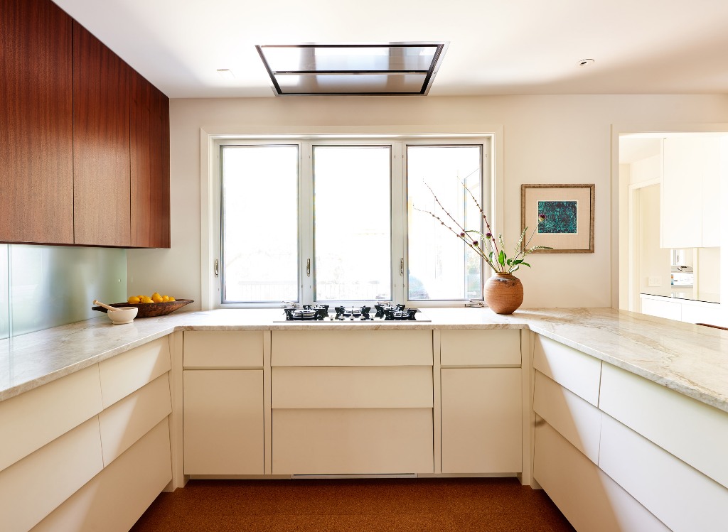 A neutral kitchen design with particle countertops