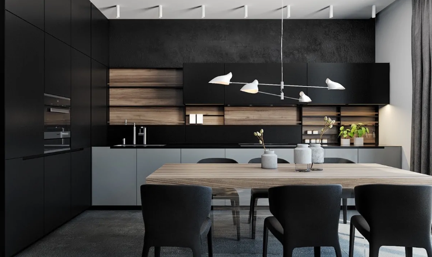 A minimalist black kitchen made cozier and more welcoming with a wooden backsplash and a wooden table next to it
