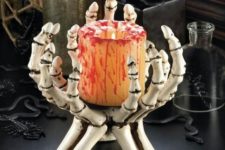 a candleholder could become a cool centerpiece for a halloween table decor