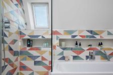07 The tiles are geometric, color block and very bright to continue the decor of the extension