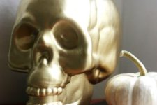 10 a gold skull candleholder can be eaisly DIYed and used anytime for Halloween decor, it will match most of themes