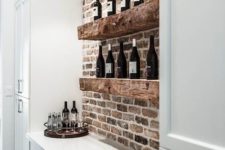 10 extra thick rough wooden shelves in front of a brick wall will definitely add texture and interest to your space