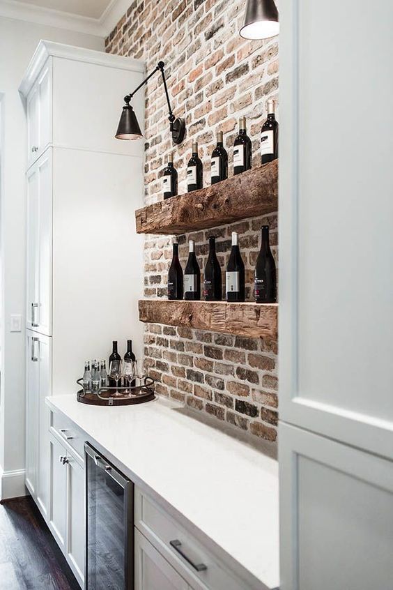 extra thick rough wooden shelves in front of a brick wall will definitely add texture and interest to your space