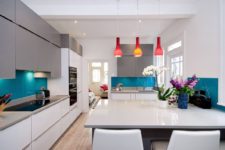 11 a minimalist open layout refreshed with bright blue ktchen backsplashes and bold red pendant lamps over the table
