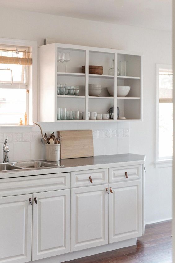 closed lower cabinets and open upper ones for a neutral and simple farmhouse kitchen