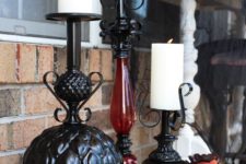 13 turn thriftstore lamps into Halloween candleholders and paint them black to make the decor more refined and elegant