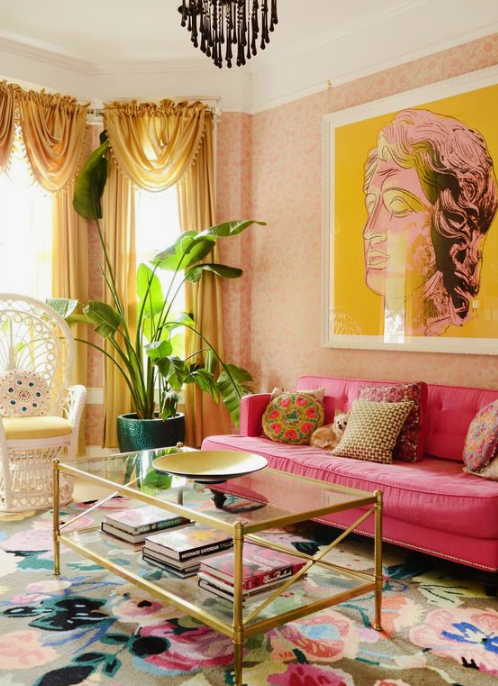 a colorful living room in yellow and hot pink, with a refined feel and chic gold touches for a sophisticated look
