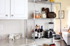 18 a lightweight metal shelving unit next to your traditional cabinets will give a more industrial feel to the space