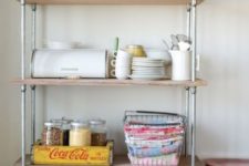 20 place a large industrial shelving unit in your kitchen to store everything you may need