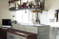 21 a small kitchen with an industrial shelving unit floating over the kitchen island is a stylish and comfortable idea