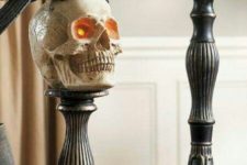 23 refined metal candleholders can be used as holders for skulls and other types of decor, too