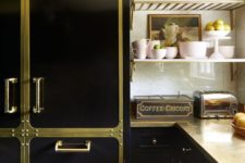 24 a creative and bold black kitchen spruced up with gold elements and matching metal countertops looks super glam