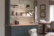 24 a graphite grey cupboard with an open upper section makes the storage comfortable and stylish