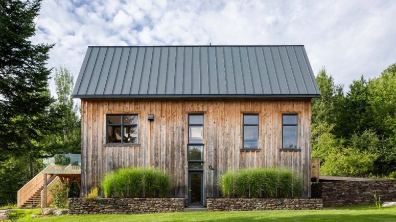 This barn house was created of an abandoned shed, the wood from which was preserved to make the barn