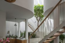 01 This unique house in Vietnam features a triple-height atrium, which fills the spaces with light