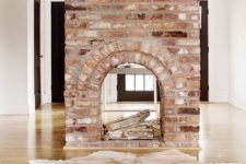 02 a gorgeous double-sided fireplace clad with brick looks very vintage and brings a character and a story to the room