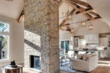03 a grey brick double-sided fireplace will give a cozy rustic feel to the space and will make it welcoming and warming up