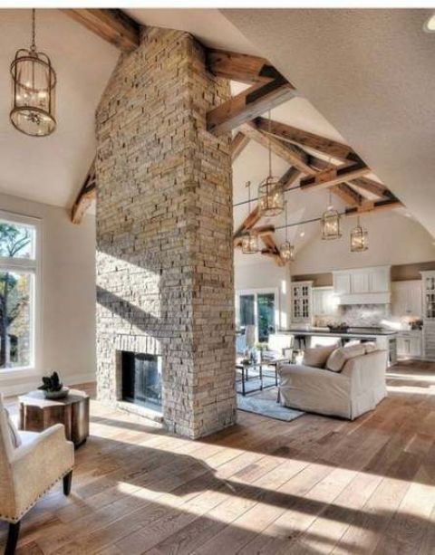 A grey brick double sided fireplace will give a cozy rustic feel to the space and will make it welcoming and warming up