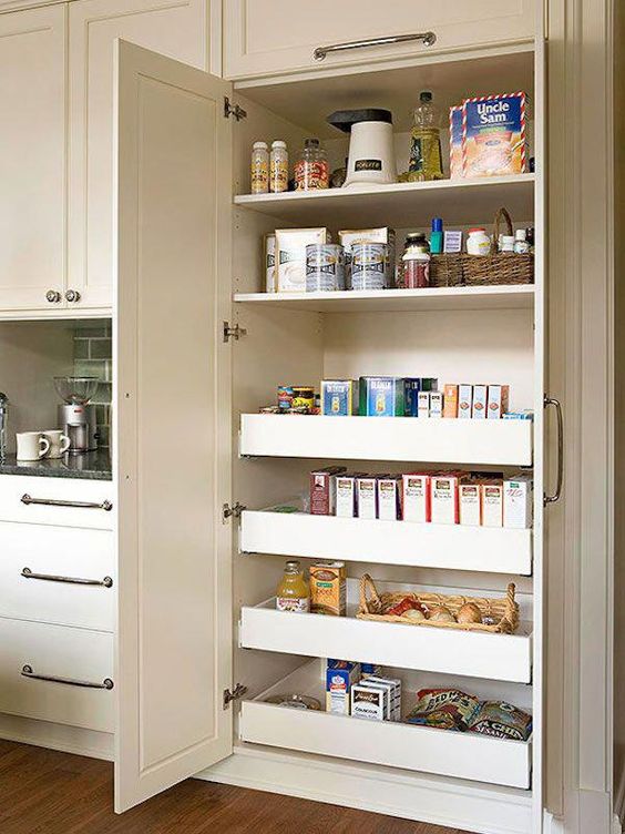 a neutral built-in pantry doesn't stand out a lot from the overall kitchen decor and gives much storage space