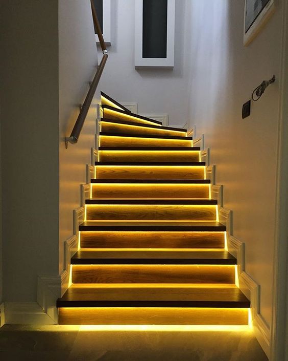 Highlight your staircase with built in lights   this way you won't need to hang any lights over the steps