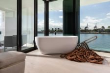 a contemporary minimalist bathroom design with views