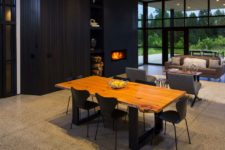 05 The dining space is right here, with a live edge table and black chairs