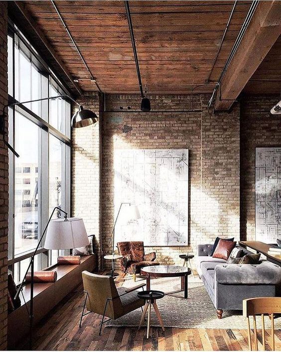 a chic industrial meets vintage living room with exposed metal and refined furniture