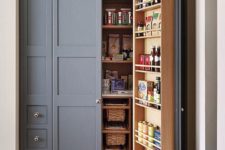 06 a built-in pantry with lots of basket drawers, shelves on the doors and inside is a cool idea to use an awkward nook