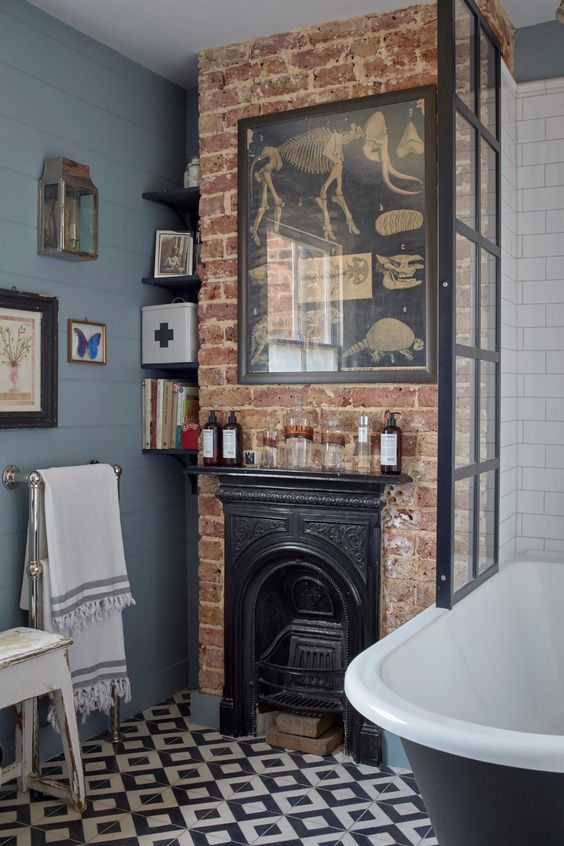 a touch of brick in the bathroom with a faux fireplace will instantly give it an industrial and vintage feel