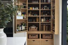 08 a large built-in pantry with neutral shelves, drawers and baskets feels and looks rustic