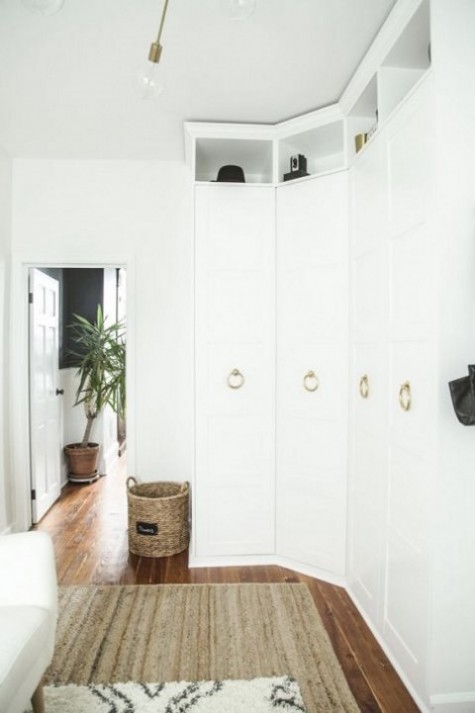 stylish brass pulls change the look of an IKEA Pax that will become a stylish and chic wardrobe for a bedroom