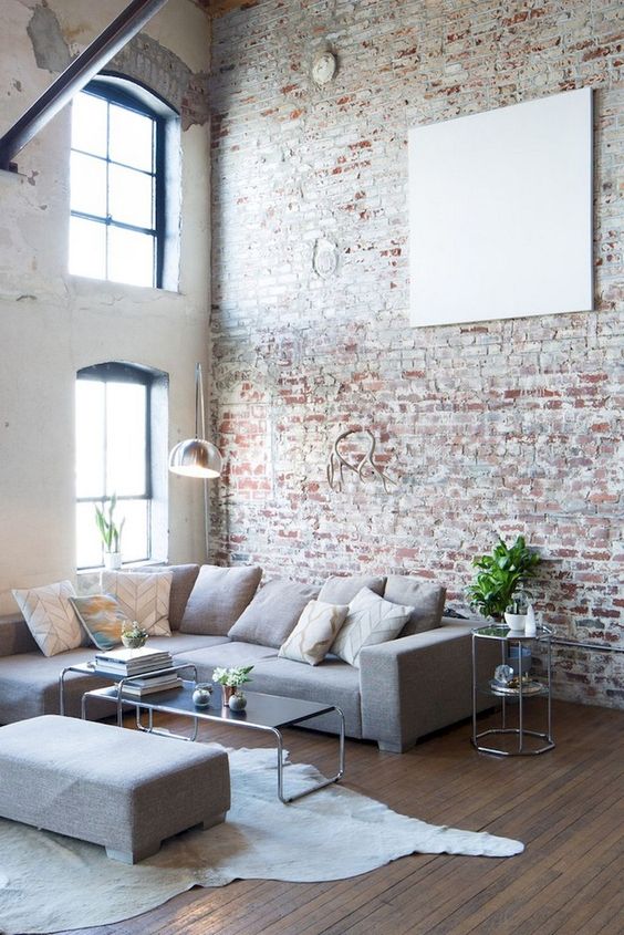 a neutral brick wall and factory-like windows make the space feel more industrial and more catchy
