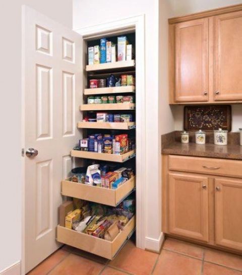 A small built in pantry with pull out shelves is a super functional idea that is a great fir for small spaces   you'll use every inch