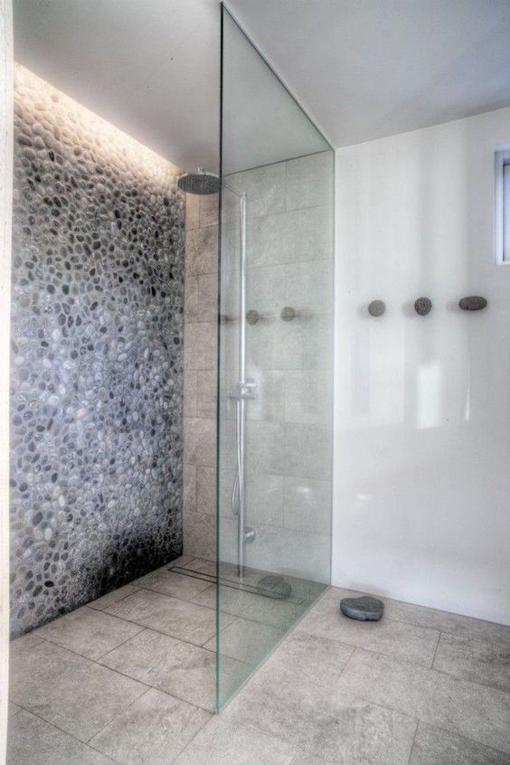 add built-in lights to the shower space to create a feeling of a skylight and make it more welcoming