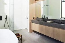 10 The master bathroom is contemporary, with a sleek vanity and a stone countertop plus a bathtub