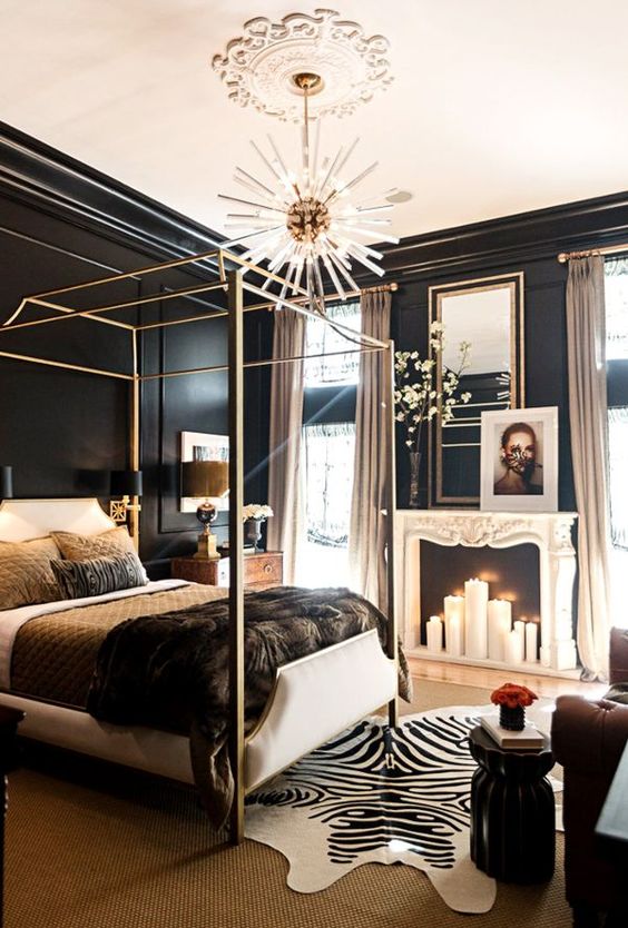 a white upholstered bed with a chic metallic canopy frame looks cohesive in this bold and quirky bedroom