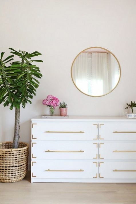 an IKEA Songesand dresser hack with gold pulls and corner braces is a timelessly chic piece
