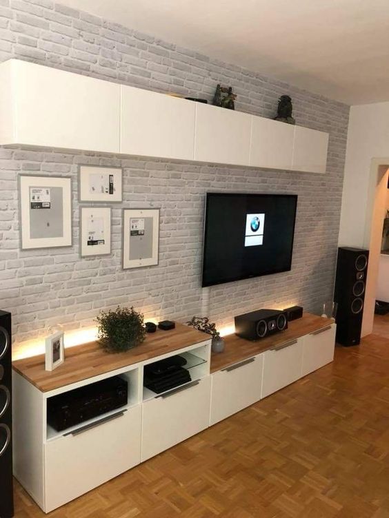 Some additional lights accent this TV unit and make this space more eye catching