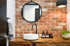 11 a contemporary bathroom is made cooler and more modern with a red brick wall and a felt pendant lamp