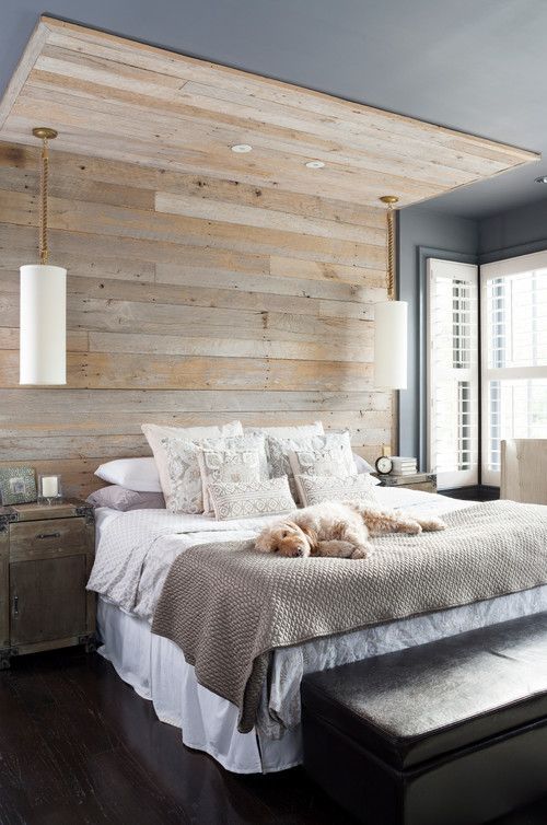a reclaimed wooden wall and ceiling part make the bedroom feel cozier and a bit industrial