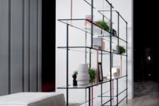 13 a very ethereal shelf of metal and glass doesn’t look bulky and adds interest and eye-catchiness to the space