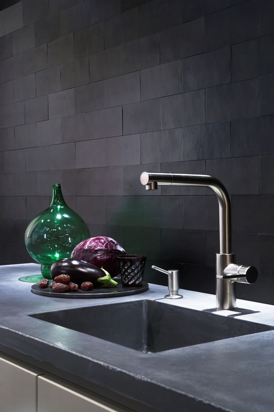 matte black tiles with mathcing grout look very unusual and textural adding interest to the space