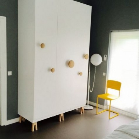 an IKEA Pax wardrobe hack with Muuto dots and Superfront legs looks very eye-catchy, whimsical and funny