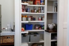 15 a cool small yet functional built-in pantry with sliding doors that allow opening it easily and fast