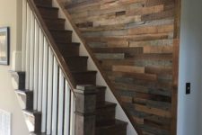 16 a reclaimed wooden wall over the staircase is a cool way to add interest to this blank wall and make the space cozy